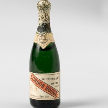 Miniature green glass bottle of vintage champagne (Mumm)