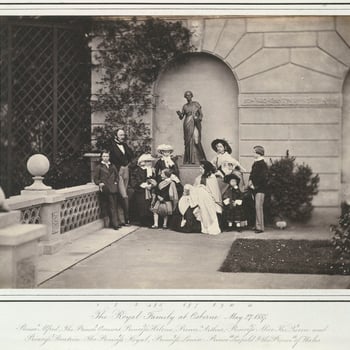Photograph of The Royal Family on the terrace at Osborne. From left to right:  Prince Alfred, Prince Albert, Princess Helena, Princess Alice, Prince Arthur, Queen Victoria holding Princess Beatrice, Princess Royal, Princess Louise, Prince Leopol