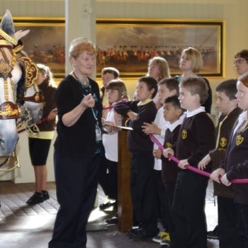 Pupils visit the Gold State Coach at the Royal Mews