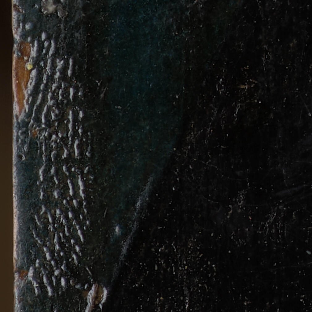 Close up of a painting with a thumb print in the paint.