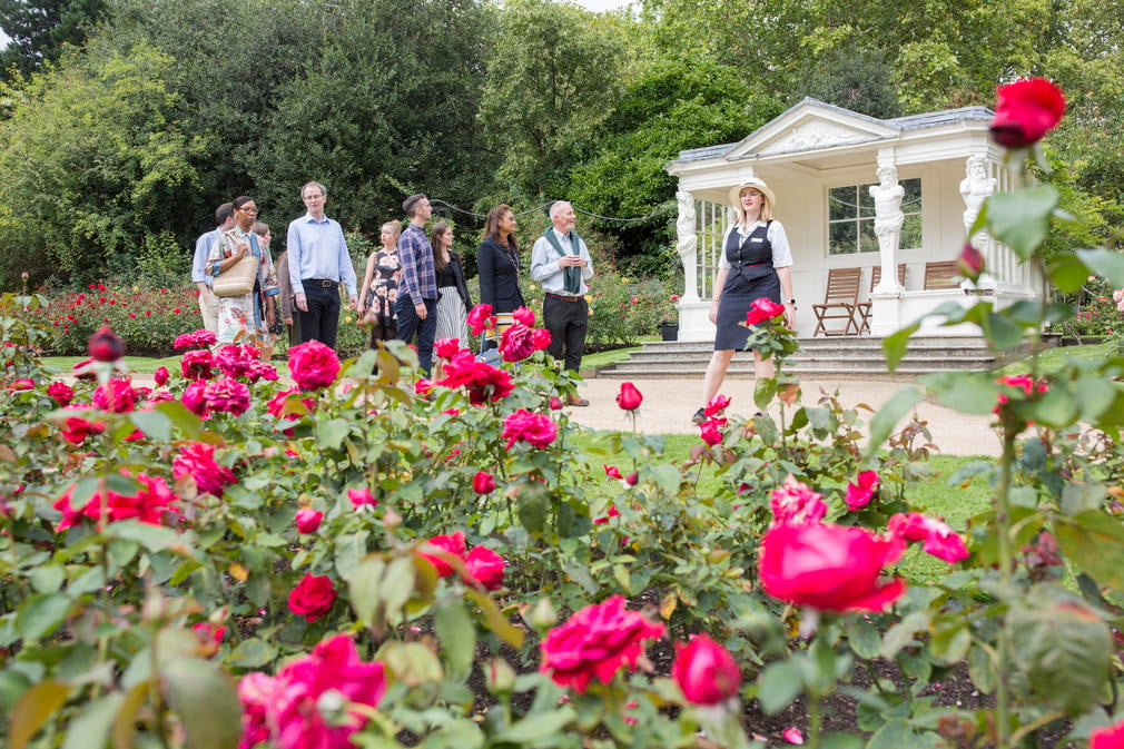 Visitors on a tour of the garden of Buckingham Palace