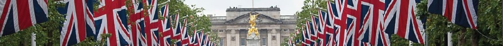 detail of buckingham palace and union jack flags