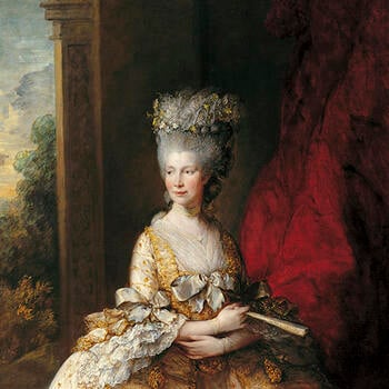 Queen Charlotte wearing a gold tasseled silk dress.