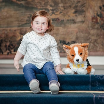 Child with toy dog