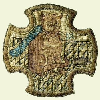 An embroidered panel, of cruciform shape, depicting a ginger cat with a mouse on a chequered floor, bearing the cipher of Mary, Queen of Scots. 
The Scottish Queen was a skilled needlewoman and there is another panel by her in the Royal Collection. A