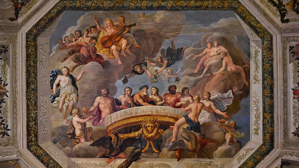 Ceiling painting showing gods, cherubs and a banquet by Antonio Verrio