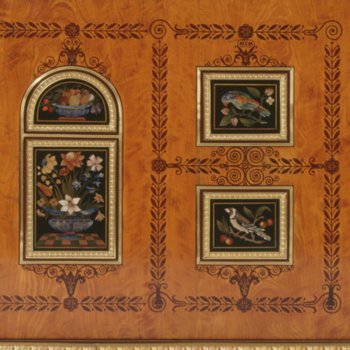 close up of wooden cabinet decorated with inlaid flowers and birds